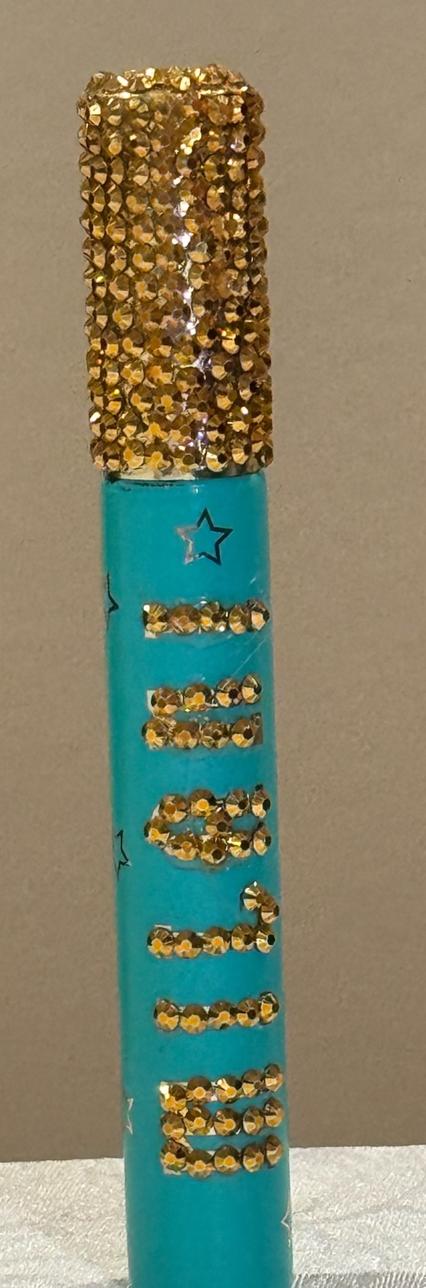Blue beauty stick bedazzled by Stel with gold rhinestone lettering