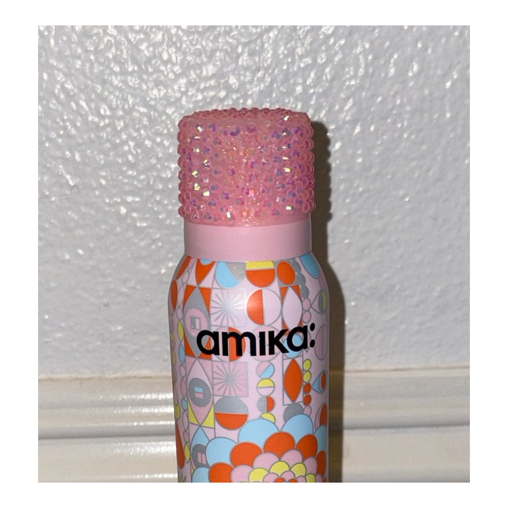 Close-up of bedazzled Amika bottle by Stel